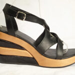 black and nature soles heels wooden clogs assembled together
